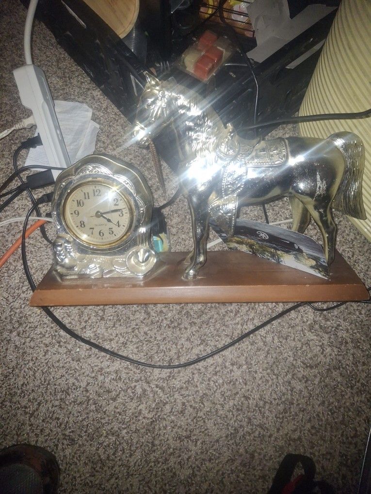 Silver Horse Snd Silver Clock On Carved Wood