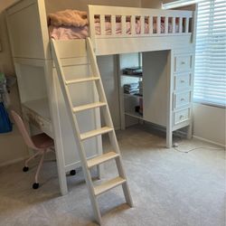 Twin loft with bookshelf and desk.