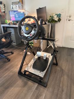 Thrustmaster Ferrari 458 Spider racing wheel + 2-pedal set mounted on a racing wheel stand/simulator stand.