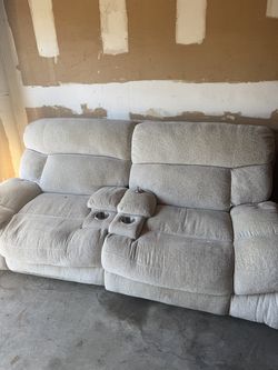 Two seat reclining sofa with center console