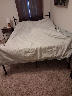 2 black iron bedframes, 2 side tables and large variety of home decor