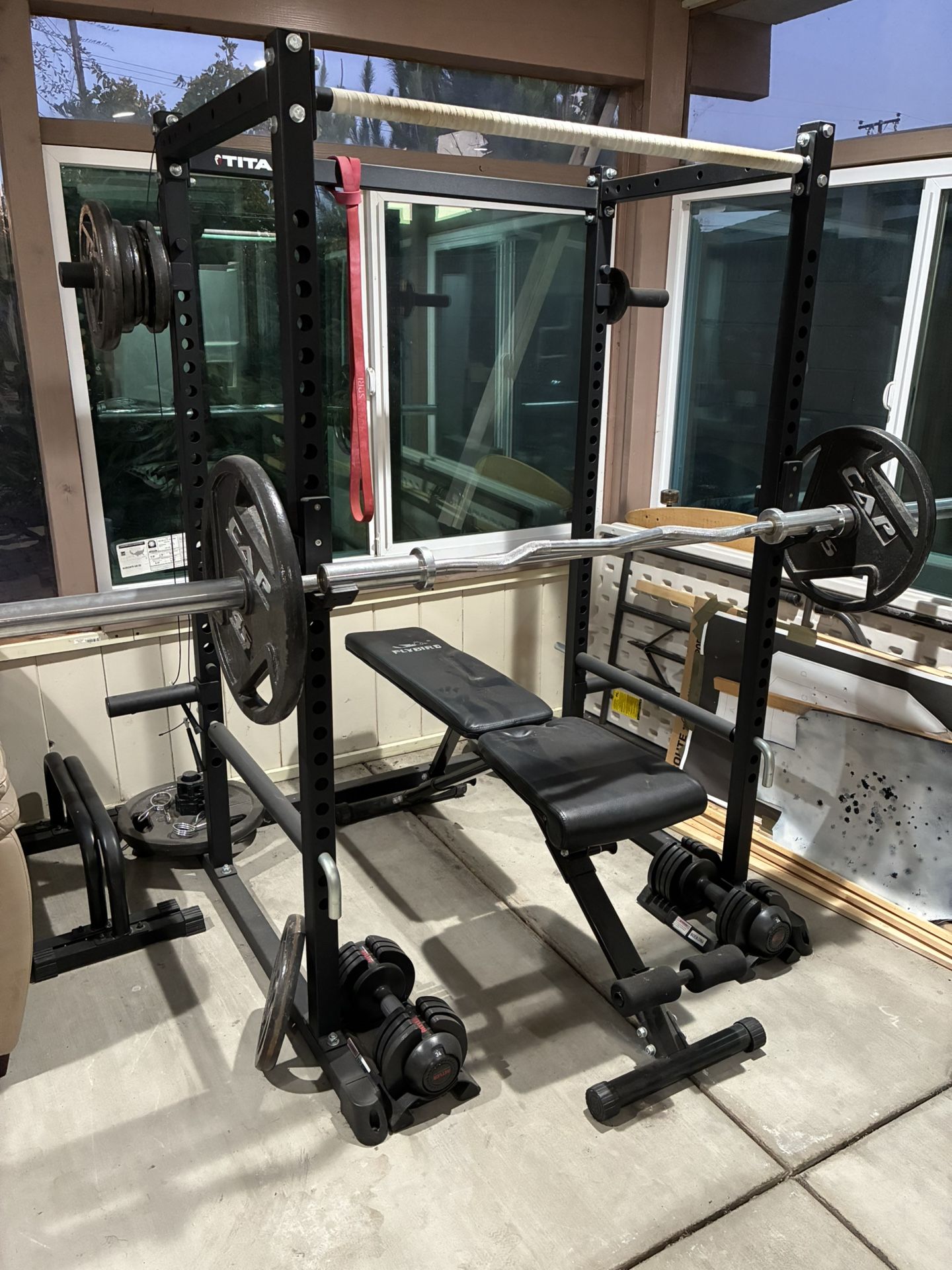 Power Rack With Barbell, Curling Bar, And Weights