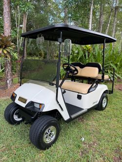 MINT EZGO 4 SEATER GOLF CART!! RUNS AND DRIVES GREAT!!