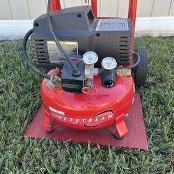 Dolly with mounted porter cable pancake air compressor