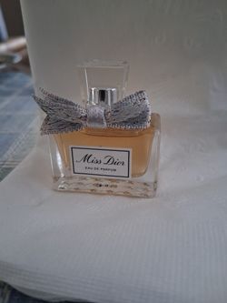 miniature bottle of Miss Dior Eau de Parfum.
