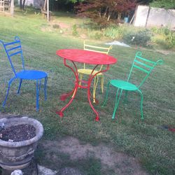 Table and three chairs