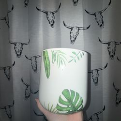 White ceramic plant pot tropical leaf design