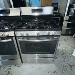 GE stainless steel gas stove, includes a receipt with a 60-day warranty.