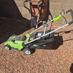 Greenworks, sixteen inch electric lawnmower with thrashing blade also