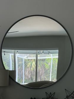 West Elm 48” mirror with black metal frame.
