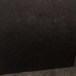 Slate top coffee table with leg rollers