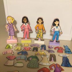 Wooden dolls 7.5” tall  and magnetic clothing more than 40 pieces