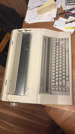 Olympia Electric Type Writer 3 (tan) Brothers Electric Type Writer (black)