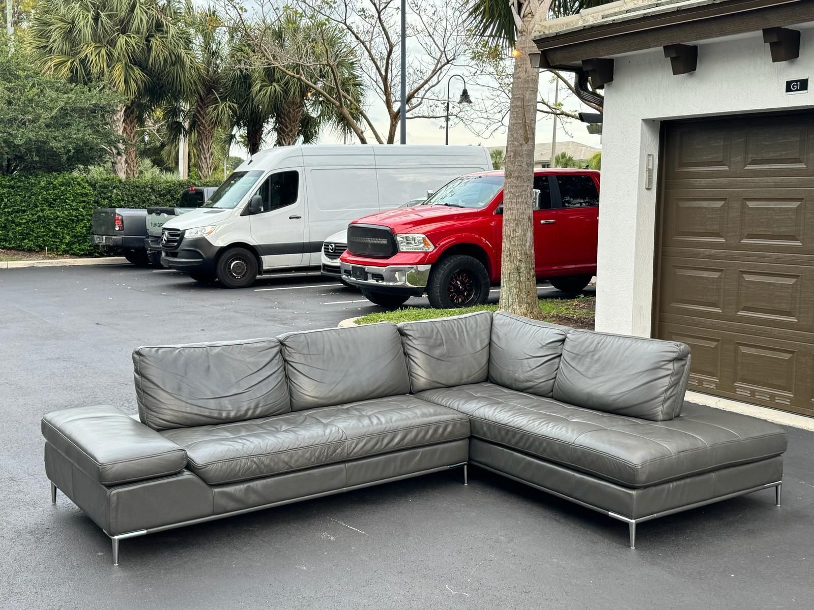 REAL LEATHER GRAY SECTIONAL COUCH WITH ADJUSTABLE BACK REST IN PERFECT CONDITION - Best offer