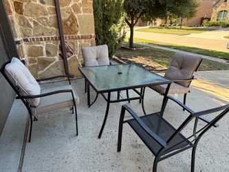 Patio table with 4 chairs and cushions