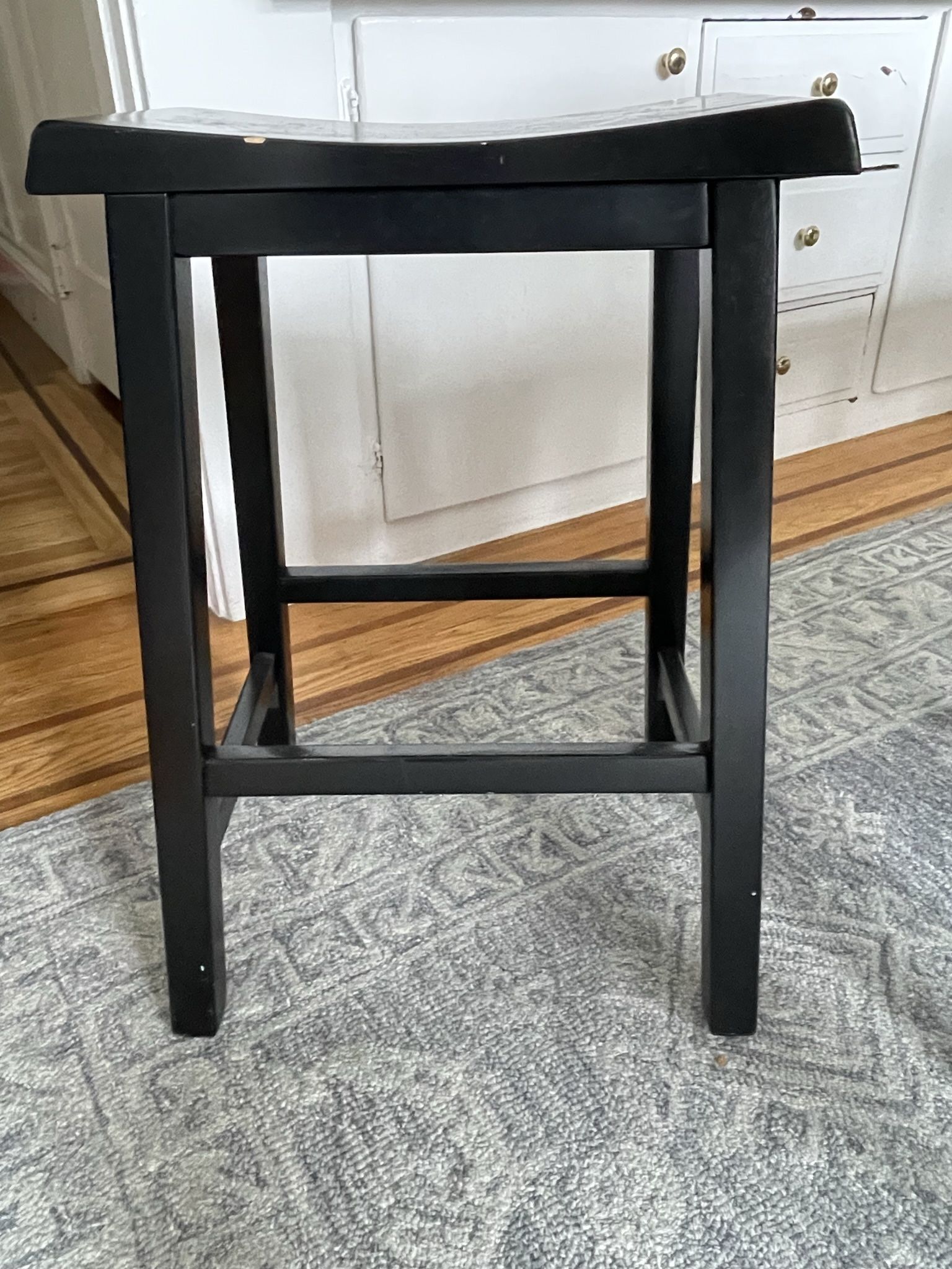 2 Black Saddle-Seat Stools 