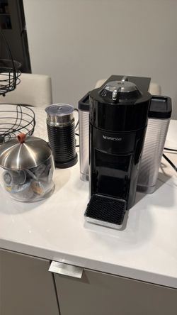 Coffee machine with froth and pod holder