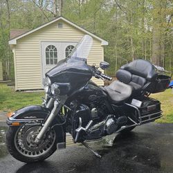 2011 Harley Davidson Ultra Classic Black Motorcycle with Vance & Hines Pipes, Upgraded Air Clear and All LED Lights. Garage kept and well maintained. 