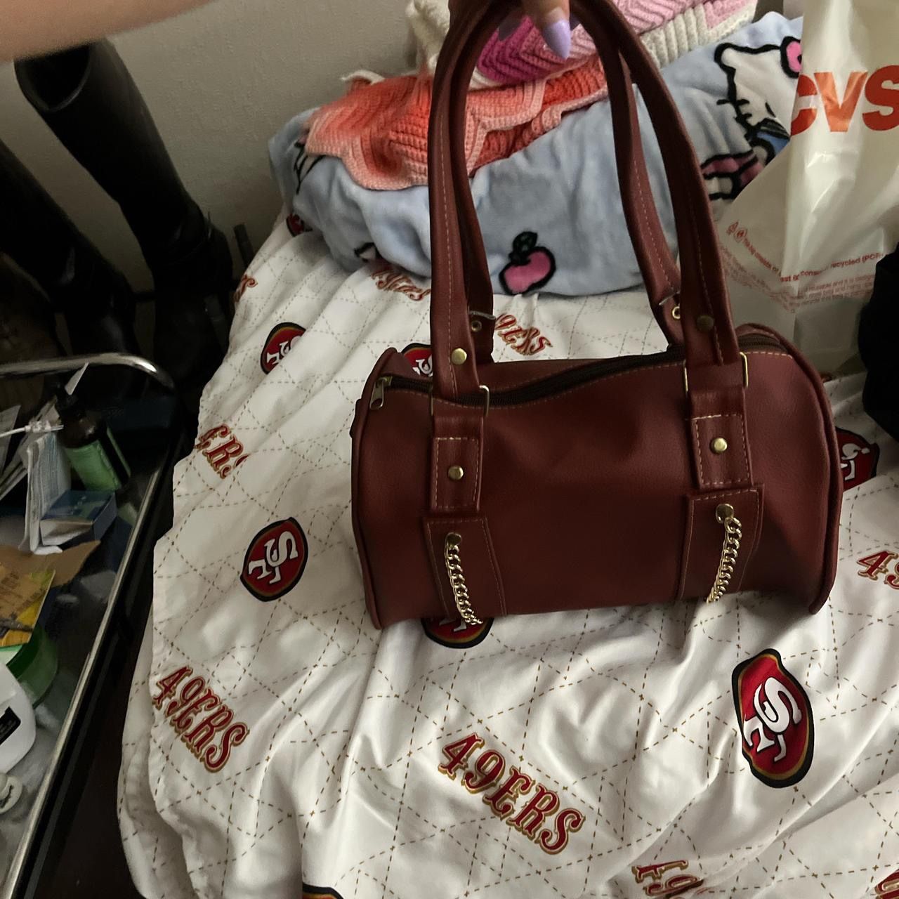 Brown purse with gold chains