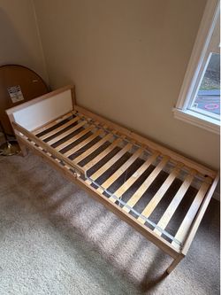 Toddler bed with mattress and sheet