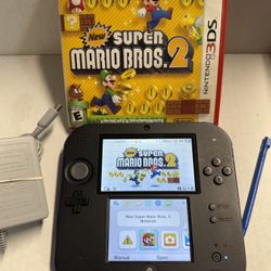Nintendo 2DS Black and Blue console comes with an original stylus, an OEM charger, and a bonus game called New Super Mario Bros. 2, along with a 4GB 