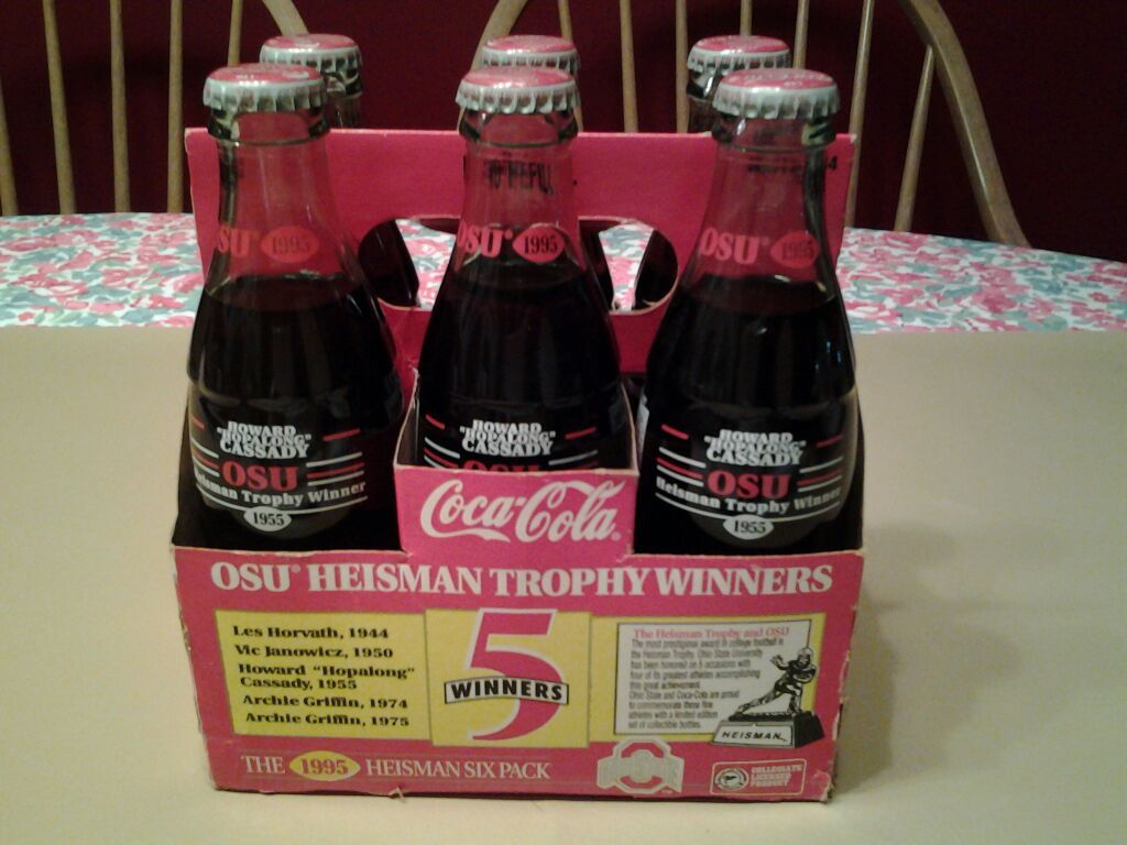 6 pack 8oz Coca-Cola with carton. All bottles say: OSU 1995, Howard "Hopalong" Cassady, OSU Heisman Trophy Winner 1955