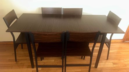 Dark brown wooden dinning table 6 seats included