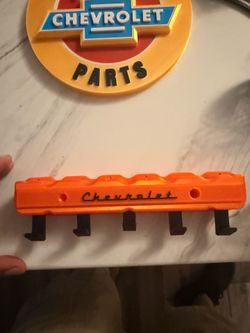 Harley Davidson and Chevy signs and key holders