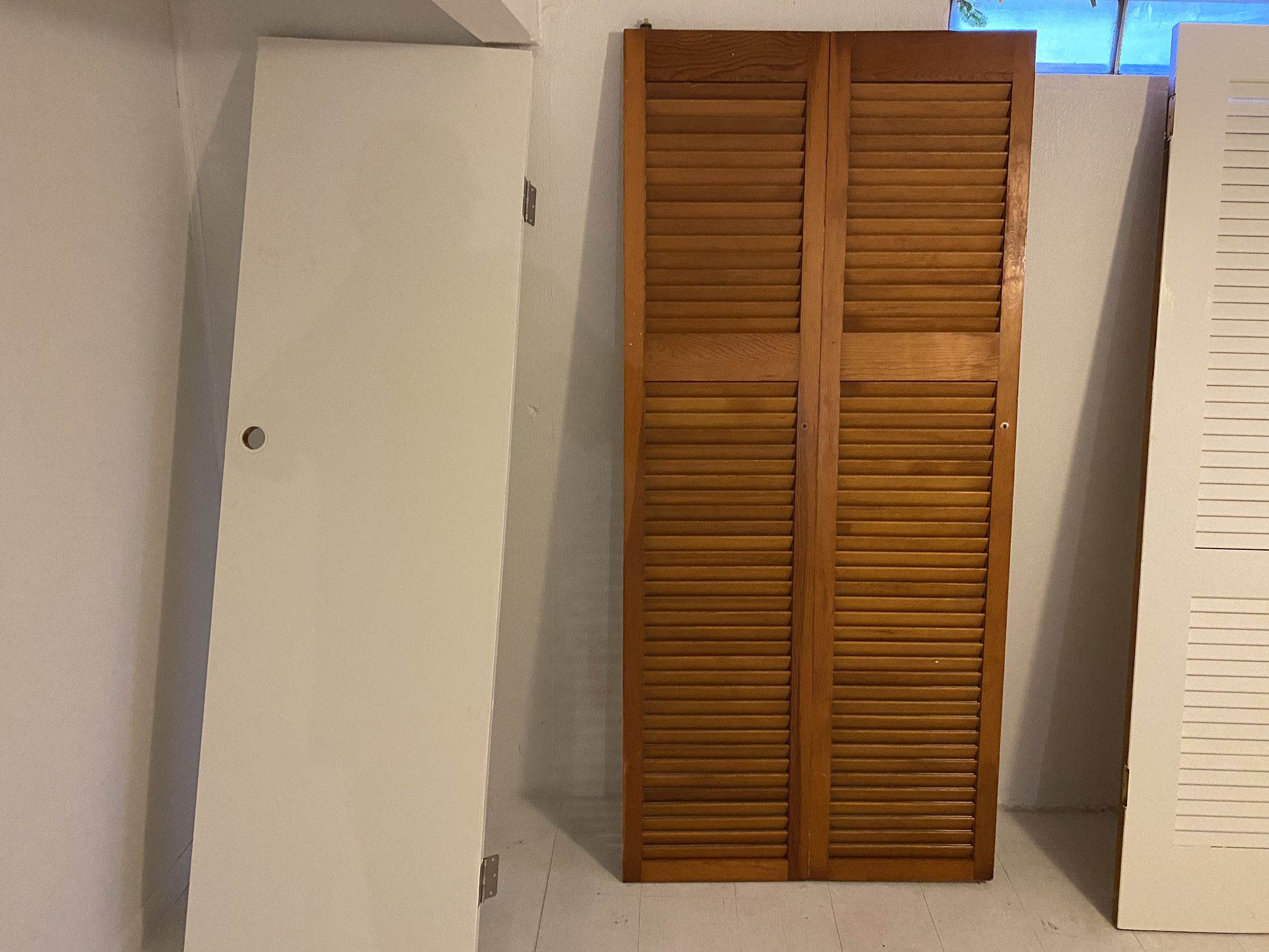 4 Solid Wood Doors. Two Are Bifold 