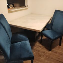 Marble Table 4 Blue Chairs 