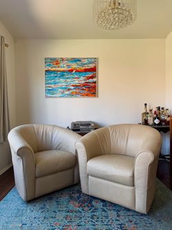Leather Swiveling Barrel Chairs