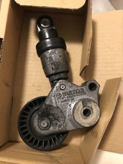 mazda 3 tensioner