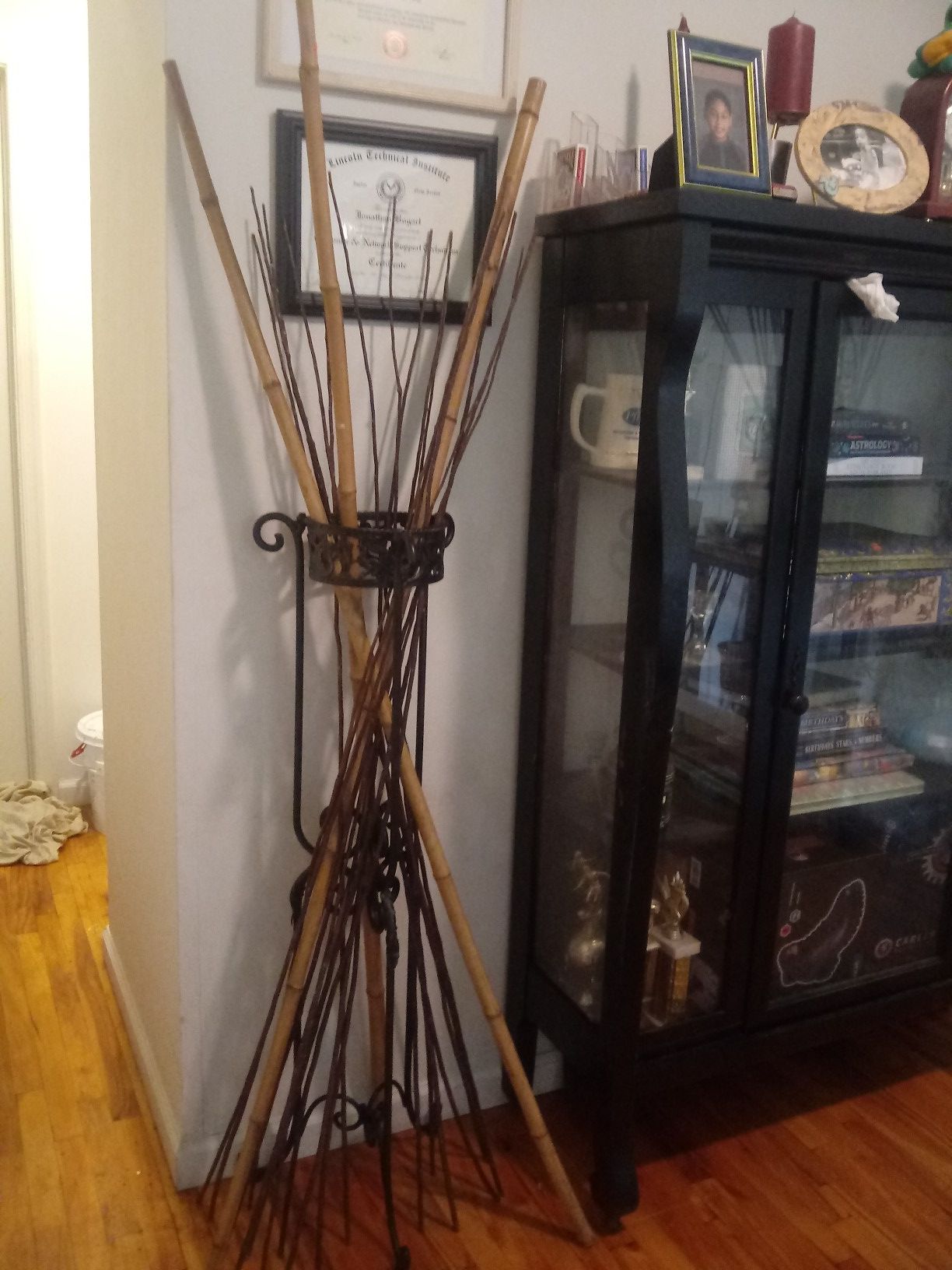 metal Stand with all the sticks about 3 ft or 3 and 1/2 ft tall