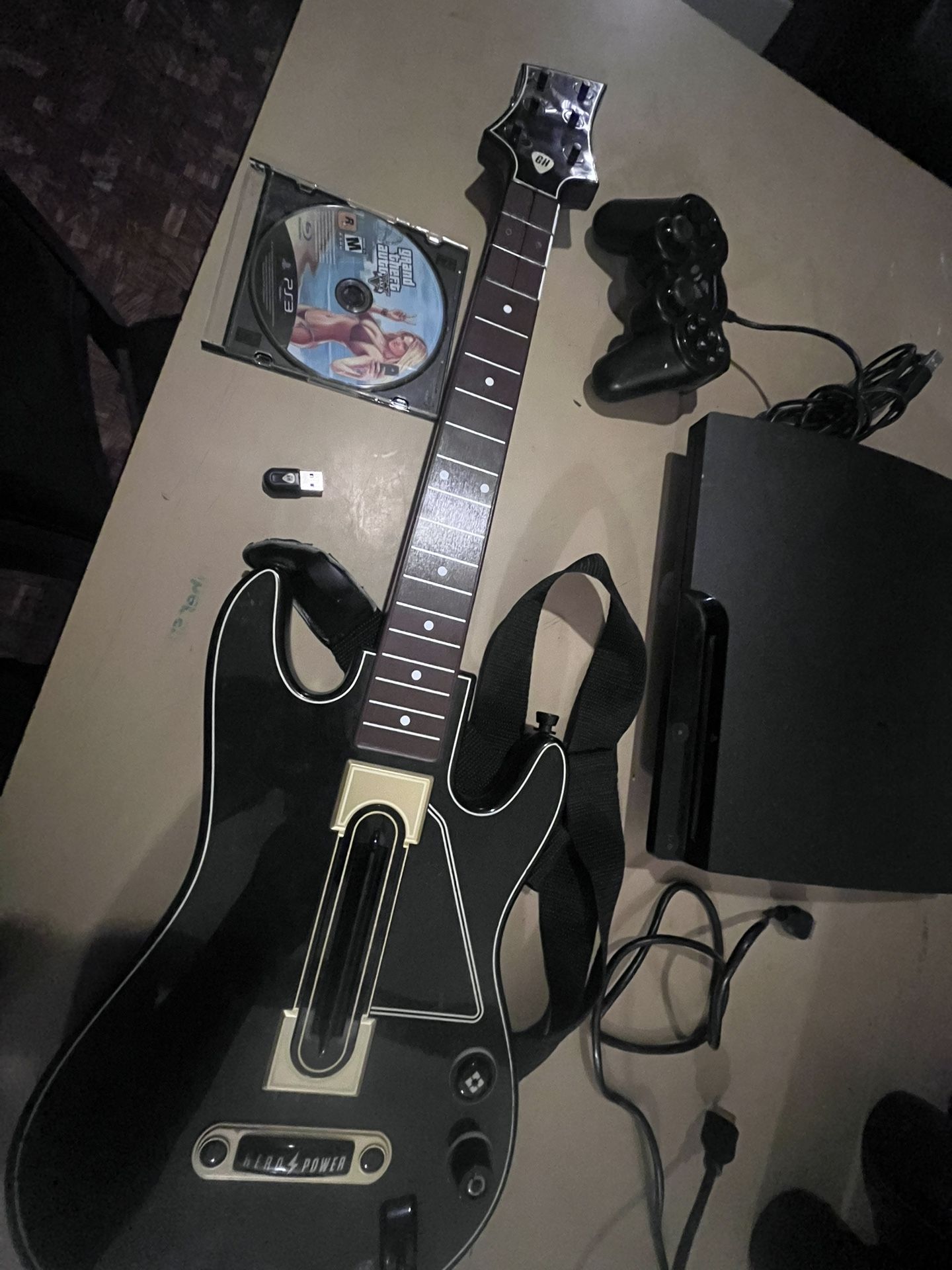 PS3 Slim 120 Gig W Guitar And 2 Games Plus Control