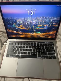 Silver MacBook Pro with Touch Bar