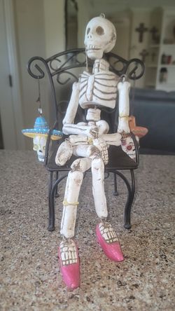 Skeleton with chair and ornaments