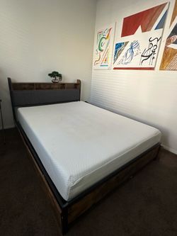Queen size bed with memory foam mattress, and topper