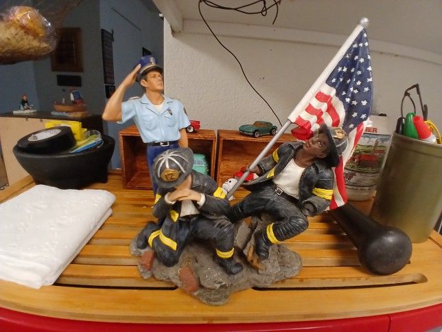 THREE FIRE FIGHTERS PAYING TRIBUTE TO FL