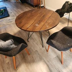 Mid-century style round dining table w/ 2 upholstered chairs – solid, no wobble.
