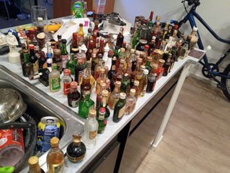 Collectable miniature bottles some full some half full