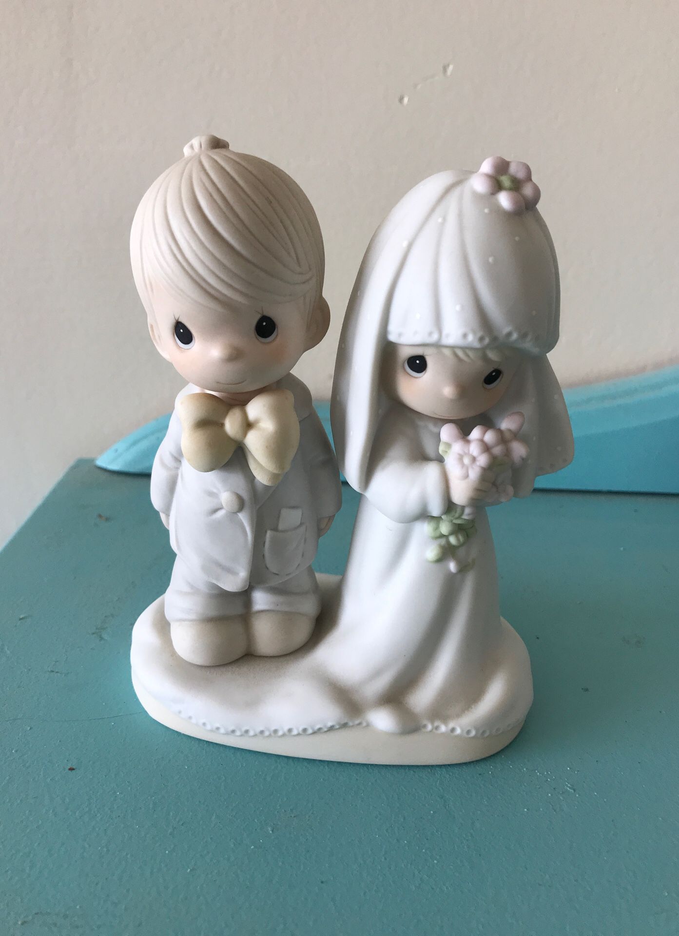 Precious Moments Bride and Groom—would make an adorable cake topper