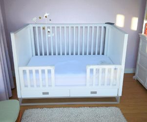 new white wooden crib