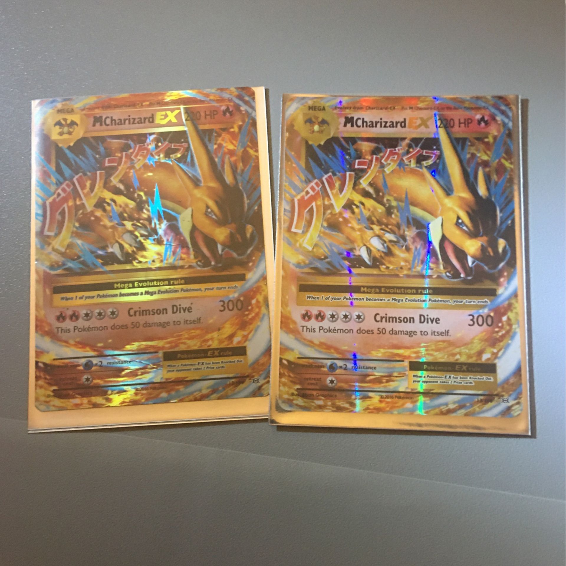 2! Pokemon XY Evolutions Ultra Rare Holo Mega M Charizard EX #13/108 HP Left Is Lightly Damage The Right One Is MINT Comes With Hard Case And Sleeve 