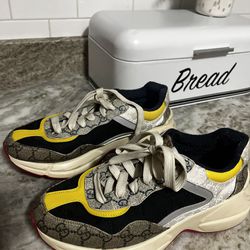 Gucci Sneakers With Navy Blue And Yellow And A Little Bit Of Pink On The Bottom