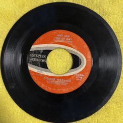 This is a vintage 7-inch vinyl record of the song "Walk On By" by Dionne Warwick, released on the Scepter Records label. 