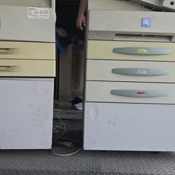 Two Large old school Printers, One Is CANON AND THE OTHER MINOLTA. "FOR PARTS"