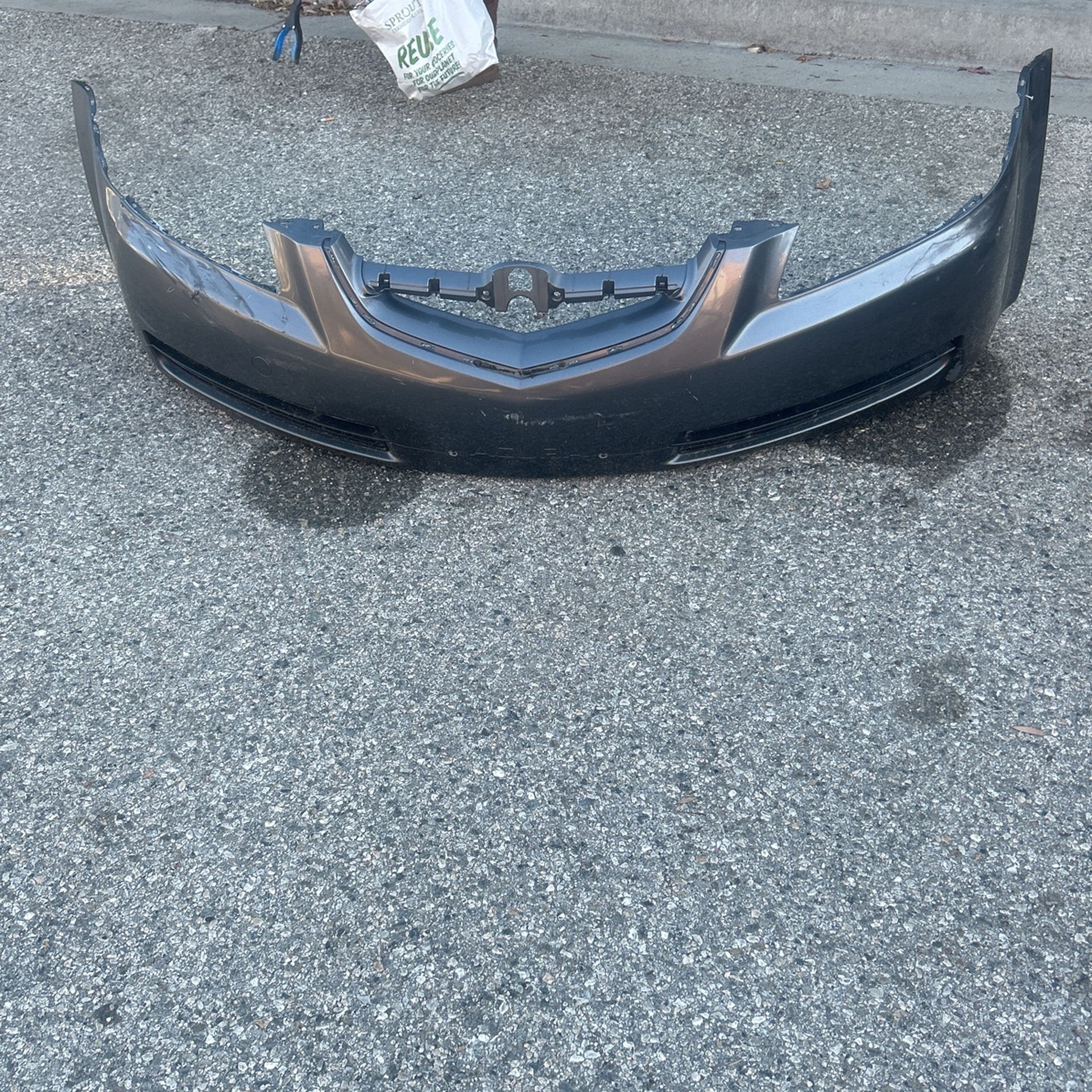 Slightly Damaged Acura 2006 Front Bumper. Grey