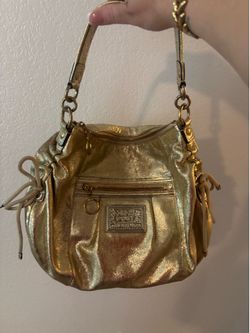 Coach Poppy Jazzy Hobo Bag in metallic gold leather featuring side drawstrings