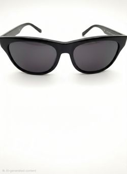 These Gucci GG0980S black sunglasses feature a bold rectangular frame and signature gold lettering.
