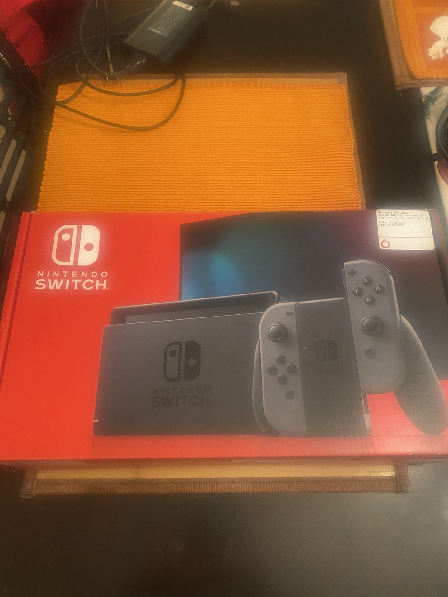 Nintendo Switch Game Console with TV adapter, Carrying Case, Screen Protector, & Super Smash Bros Game